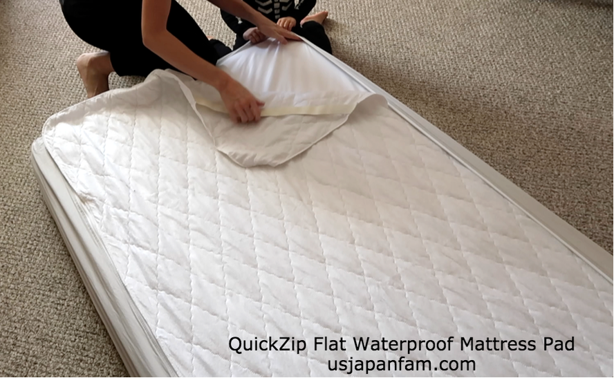 US Japan Fam loves QuickZip's flat waterproof mattress pad for quick changes!